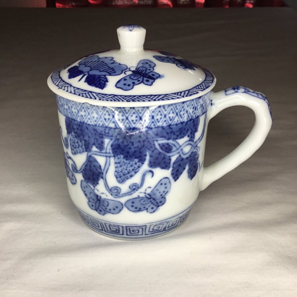 Blue and White Coffee Teacup with Lid Butterflies in the Garden Print